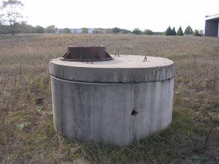 Sewer cap in a field 